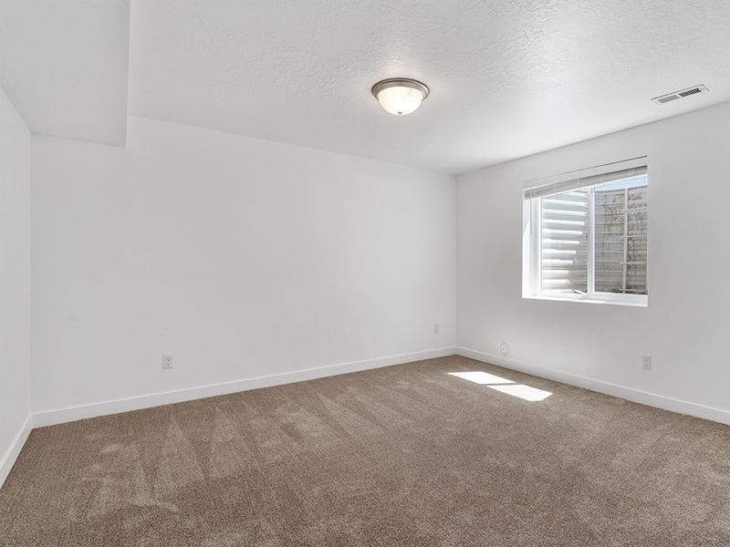 Carpeted Basement | The Park Townhomes in Layton, UT