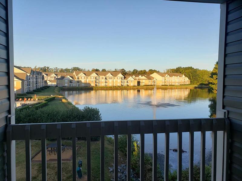 Balcony overlooking the community pond at Bridgewater at Town Center Apartments in Hampton.
