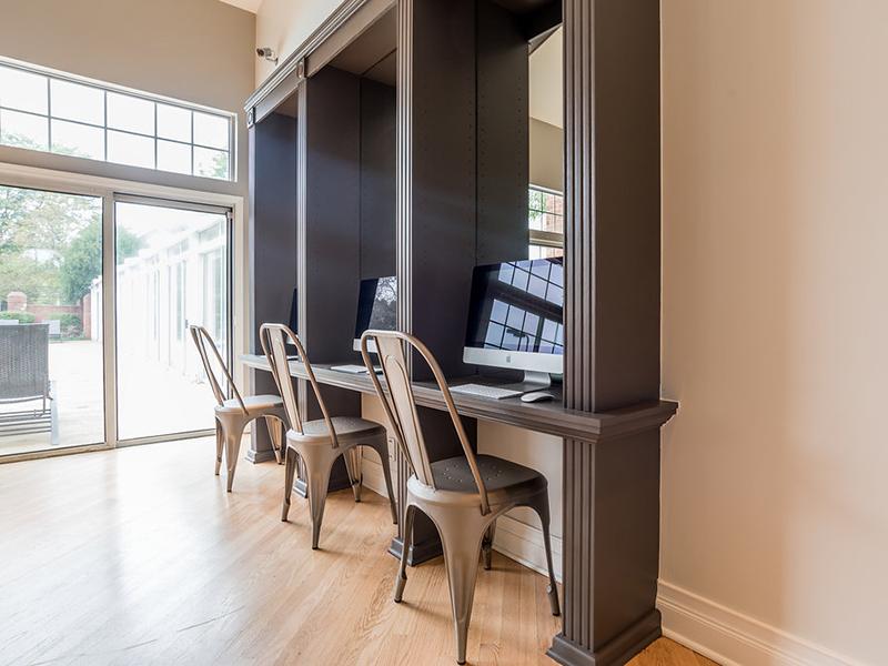 Naperville, IL Apartments for Rent - Arbors of Brookdale Business Center with desk, chairs, and iMac computers