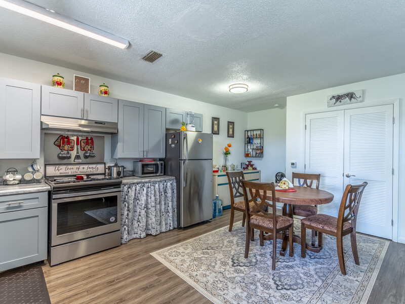 Kitchen and Dining Area | Emerald Palms Apartments in Fort Lauderdale, FL