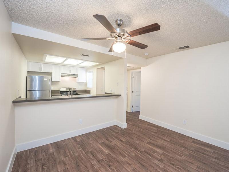 Apartments in Upland-Parc Claremont Spacious Living Room with Wood Style Flooring and Open Access to the Kitchen