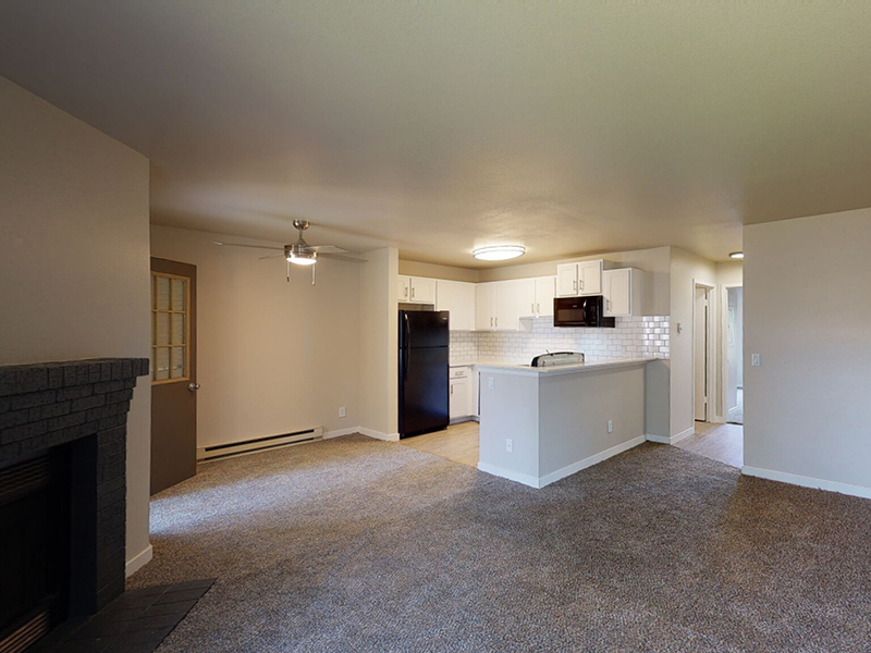 Front Room and Kitchen | The Arbors at Sweetgrass Apartments in Fort Collins, CO