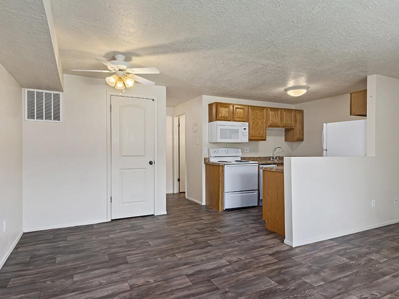 Living Room and Kitchen | Woodside at Holladay Apartments in Salt Lake City, UT
