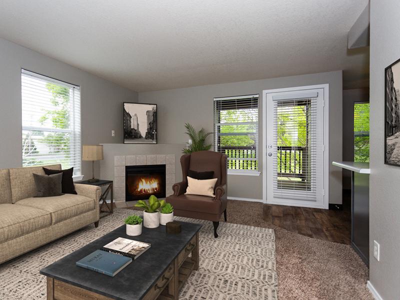 Gresham, OR Apartments - Stark Street Crossings Living Room with a Fireplace and Access to Patio or Balcony
