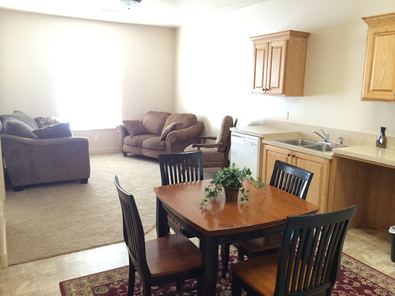 Dining Area and Living Room | Liberty Square Apartments in Ammon, ID