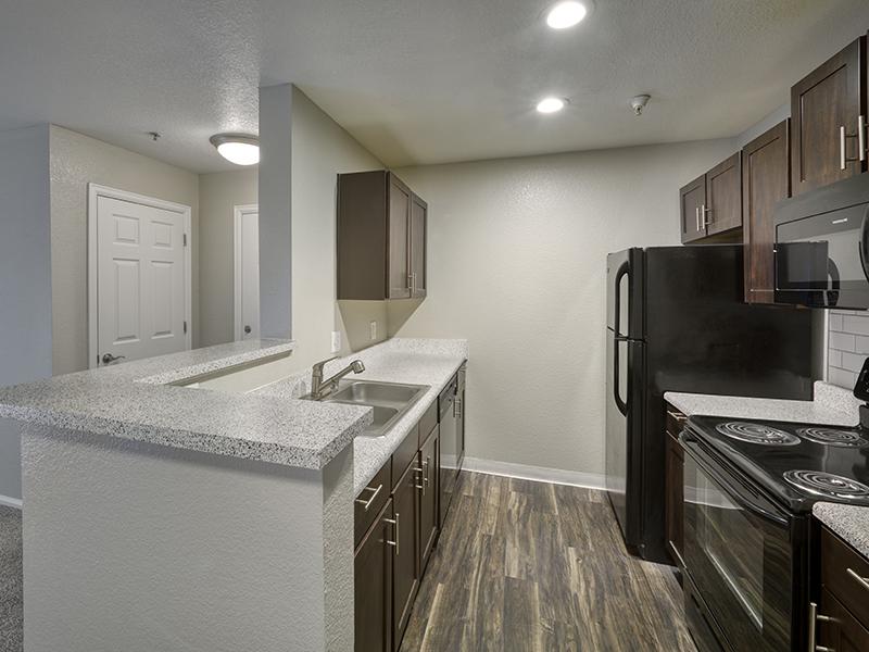 Fully Equipped Kitchen | Echo Ridge at North Hills Apartments in Northglenn, CO
