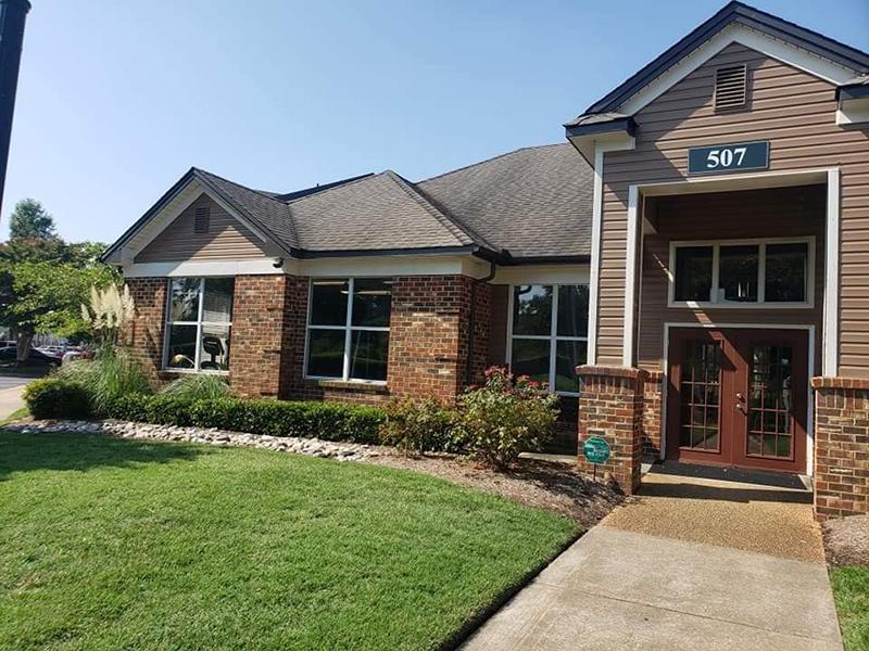 Landscaped exterior of the clubhouse at Bridgewater at Town Center Apartments in Hampton.