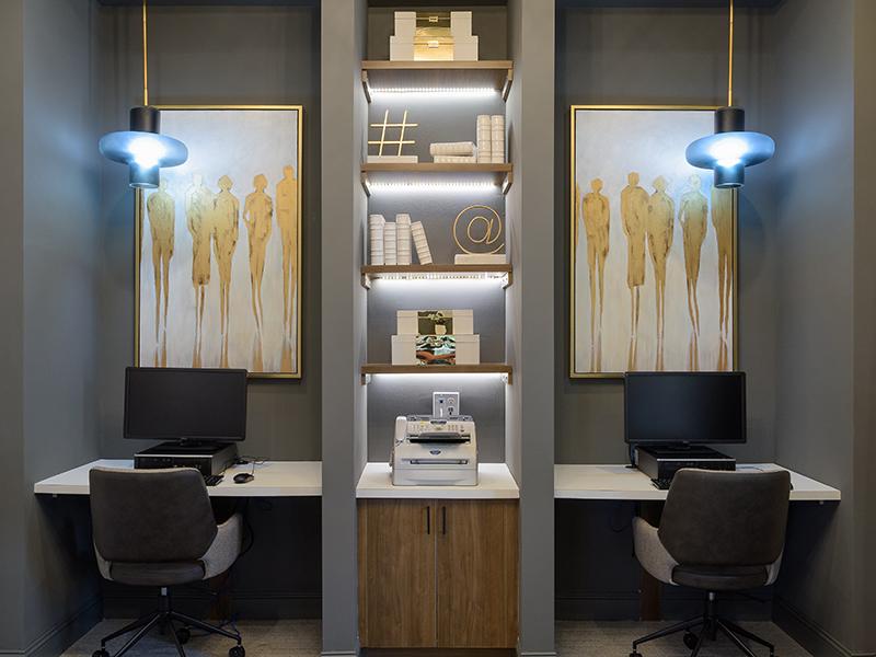 2 co-working spaces with desks and computers at Colton Creek Apartments in McDonough.