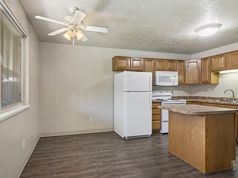 Dining Room and Kitchen | Woodside at Holladay Apartments in Salt Lake City, UT