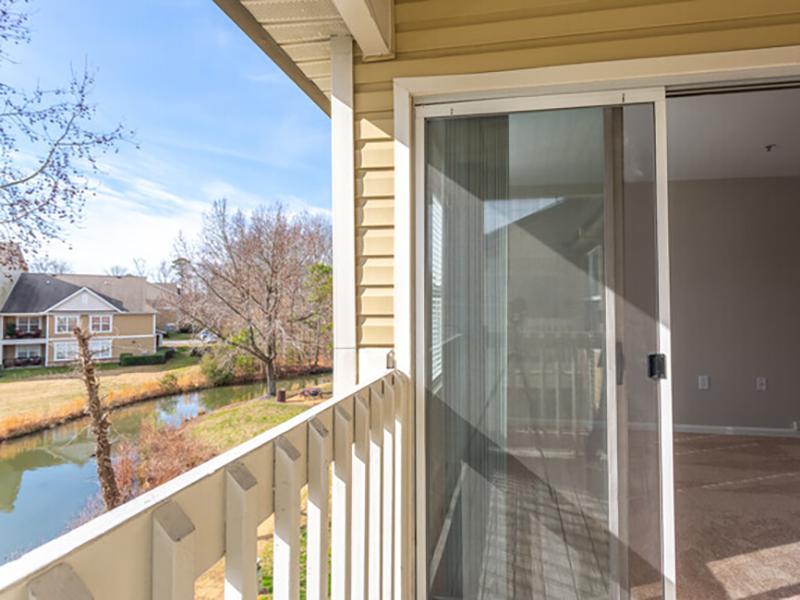 Balcony with sliding glass door at Bridgewater at Town Center Apartments in Hampton.