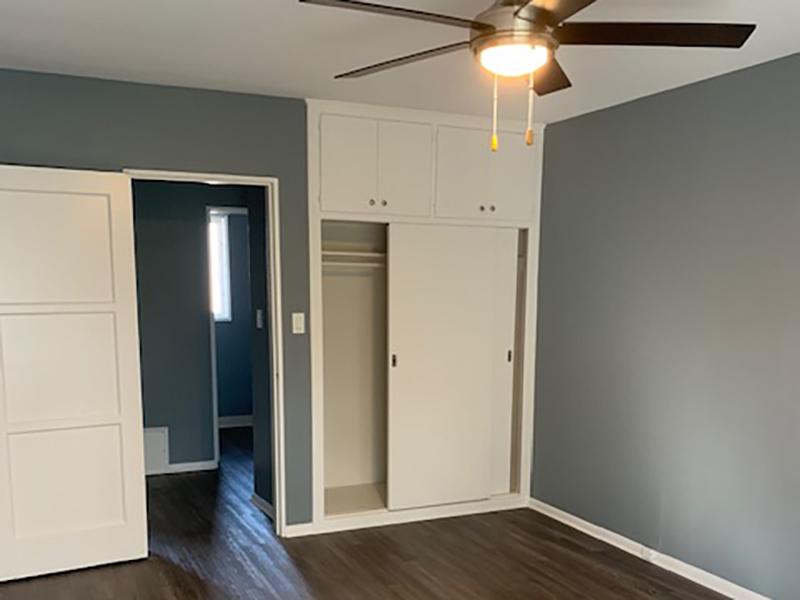 One Bedroom Apartments in Los Angeles, CA - Verdugo Mesa Apartments Bedroom with Wood-Style Flooring and Spacious Closet