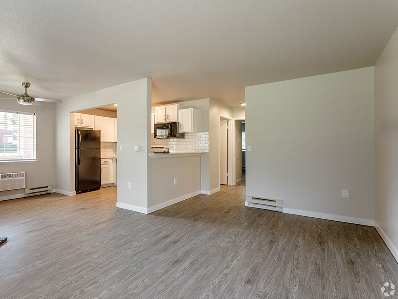 Living Room and Kitchen | The Arbors at Sweetgrass Apartments in Fort Collins, CO