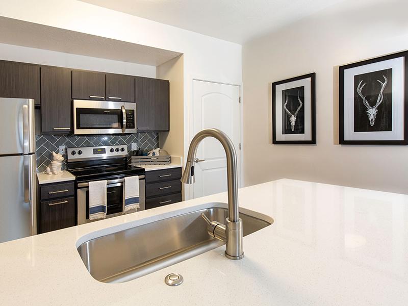 Renovated full kitchen with sink in front | Wilshire Place