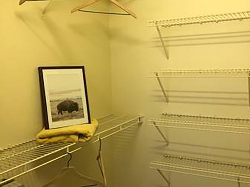 Walk in closets off the bedroom at Bridgewater at Town Center Apartments in Hampton have built in shelving.