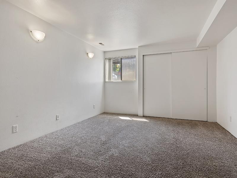 Carpeted Bedroom | Cottonwood Creek Estates Apartments in Murray, UT