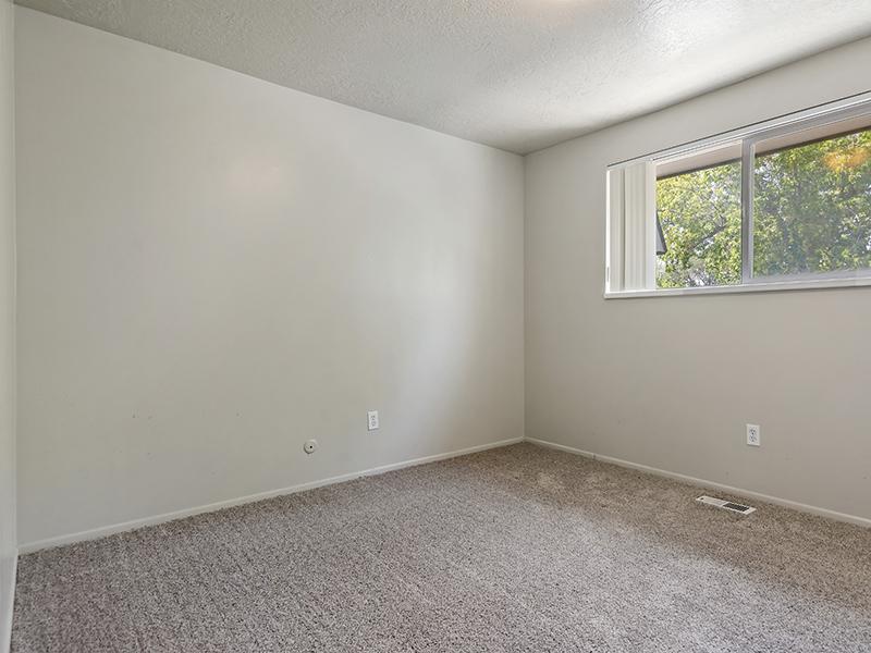 Carpeted Bedroom | Woodside at Holladay Apartments in Salt Lake City, UT