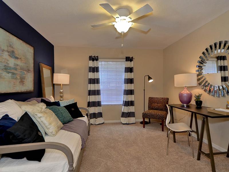 Providence Lakes apartments in Brandon model guest bedroom furnished with a pullout couch and office space
