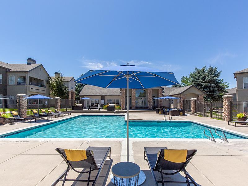 Sandy Apartments for Rent - Alpine Meadows Swimming Pool with Lounge Chairs and Umbrellas