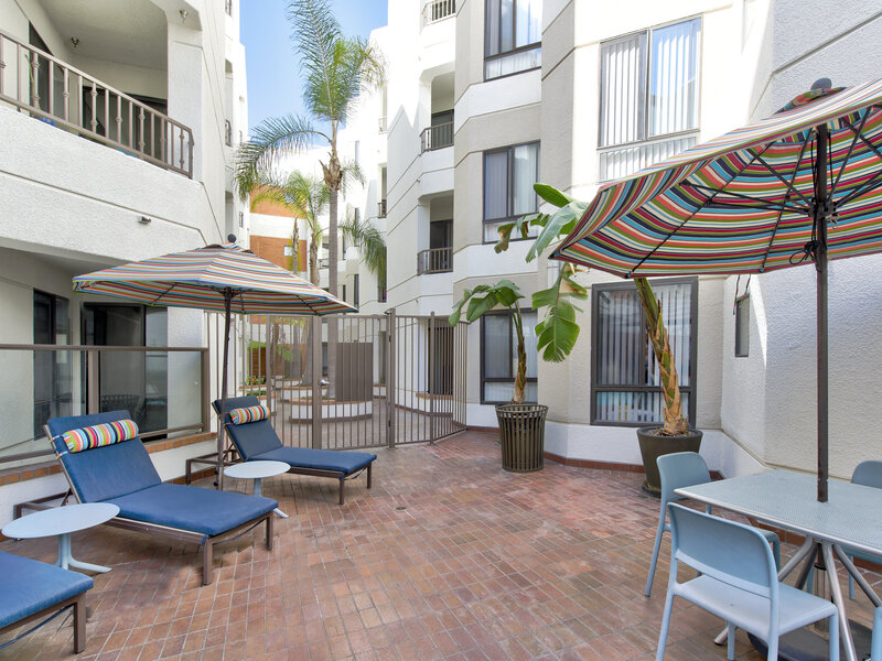 Poolside Seating | Elevation Long Beach Apartments in Long Beach, CA