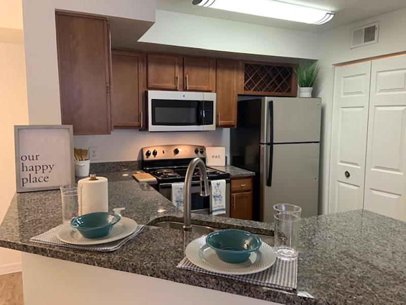 Breakfast Bar counter look into the model kitchen at Providence Lakes apartments.