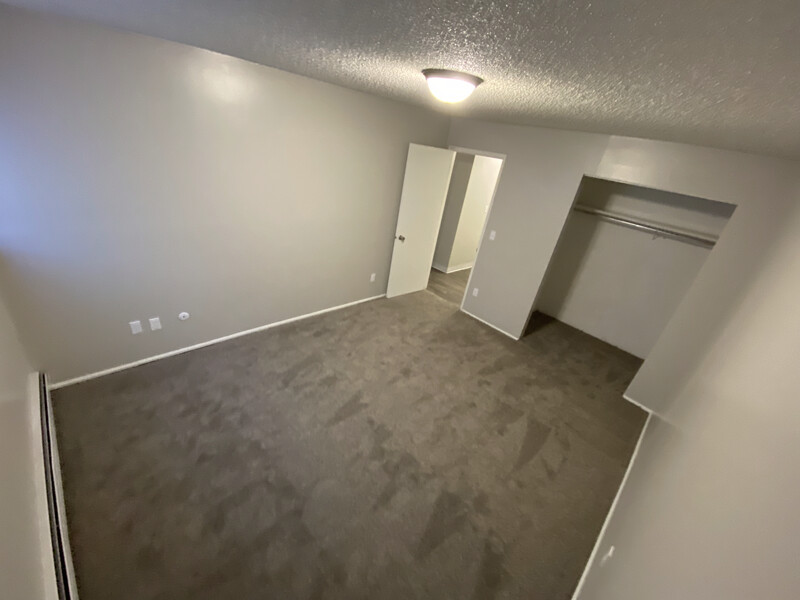 Spacious Bedroom | Conquistador Apartments in Casper, WY