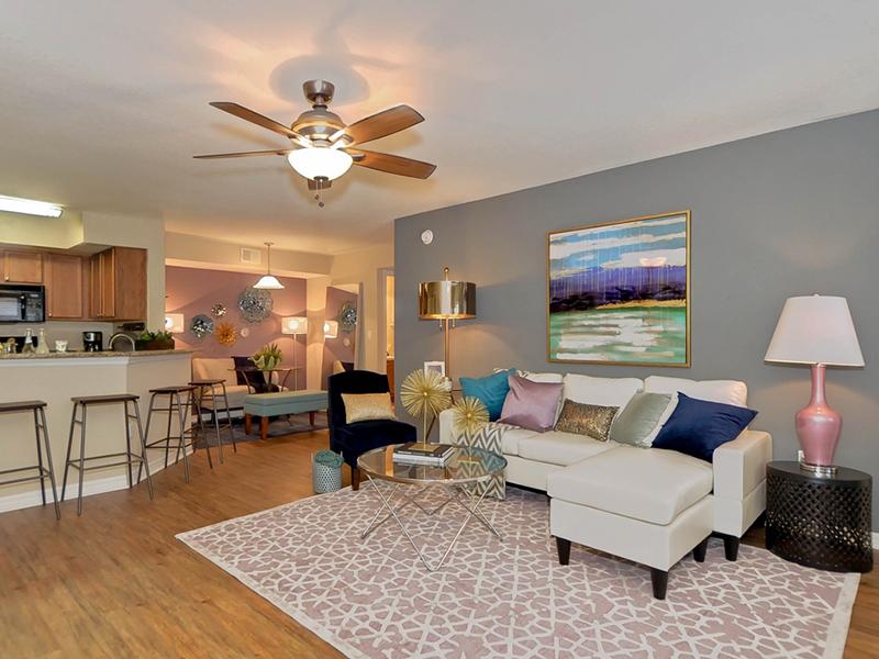 Model living room furnished with a couch and chairs at Providence Lakes Apartments in Brandon, FL