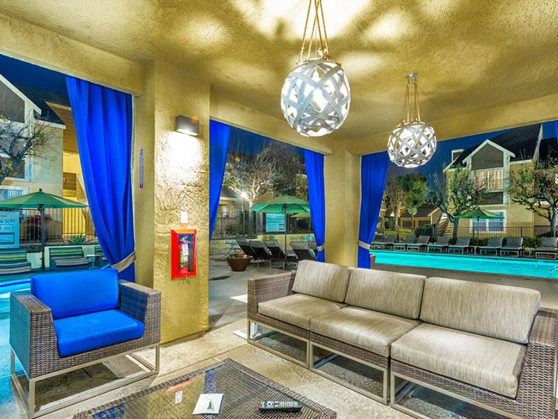 Apartments for Rent in Upland CA - Parc Claremont - Poolside Lounge Area with Couches, Tables, and Roof