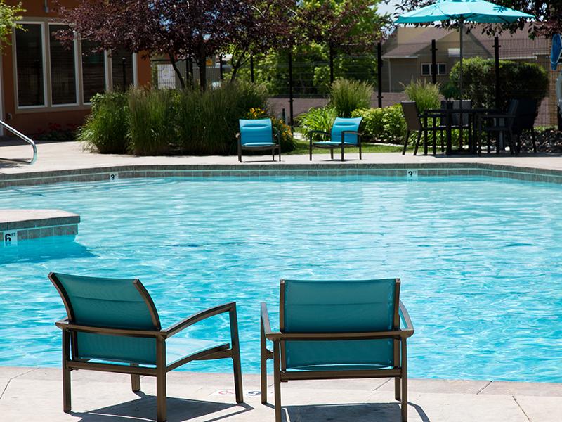 Apartments for Rent Salt Lake City, UT - Foothill Place Apartments Large Relaxing Pool with Lounge Chairs and Couches