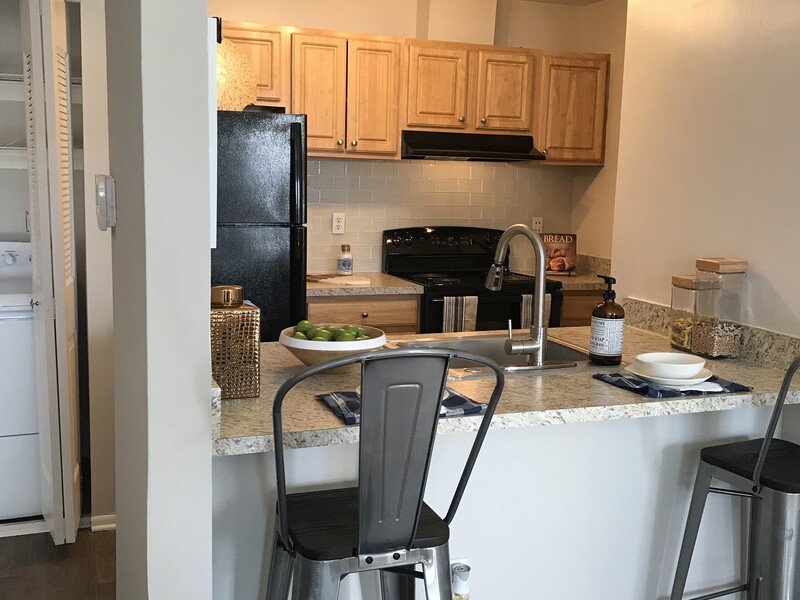 Kitchen and Seating | The Madison at Eden Brook Apartments in Columbia, MD