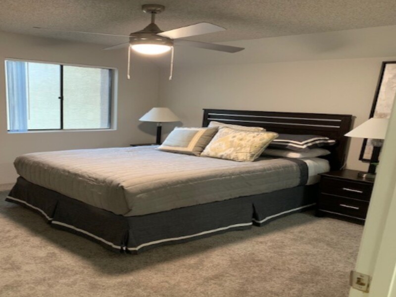 Bedroom with a Ceiling Fan | Sun Wood Senior Apartments in Peoria, AZ