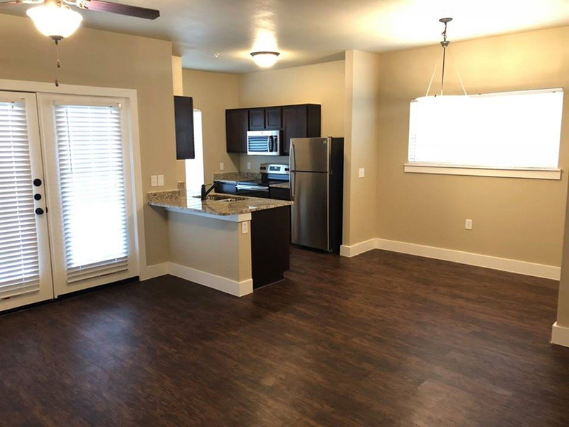Living Room and Kitchen | Woodlands of Denton Apartments