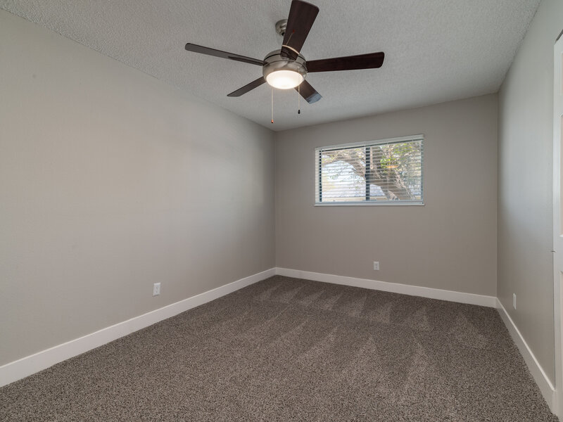 Bedroom with a Ceiling Fan | Villas Del Sol II Apartments in Albuquerque, NM